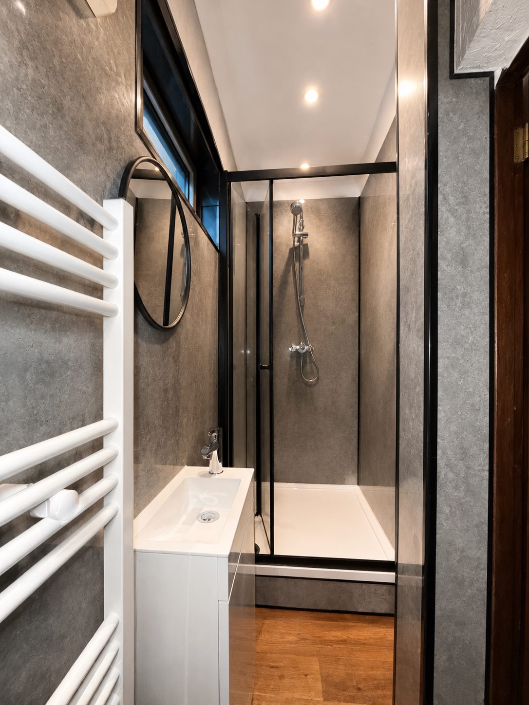 Finished shower enclosure and bathroom plumbing work