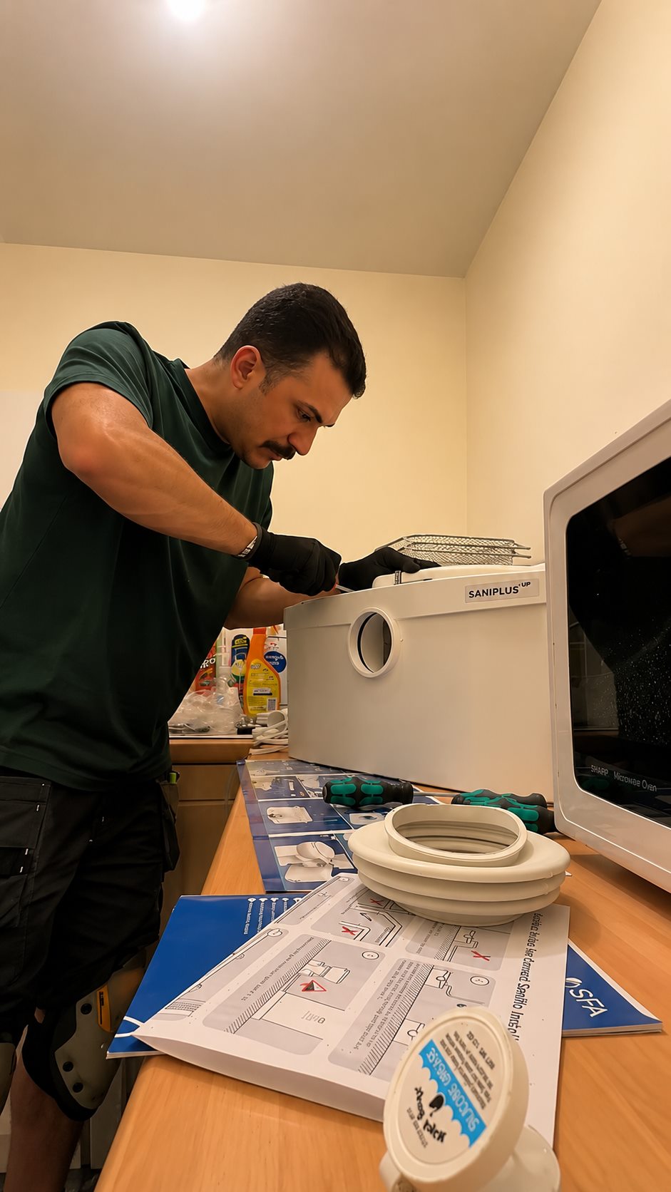 Macerator installed behind toilet in Colchester plumbing project