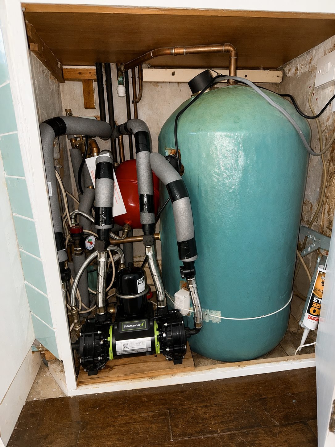 Vented cylinder and pipework inside a cupboard
