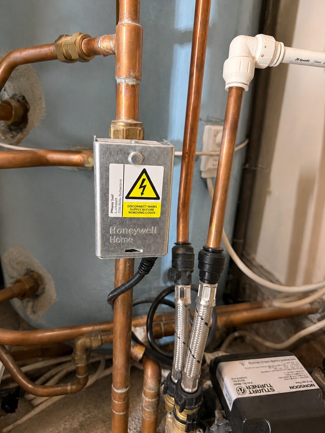 Vented cylinder pipework and controls close up